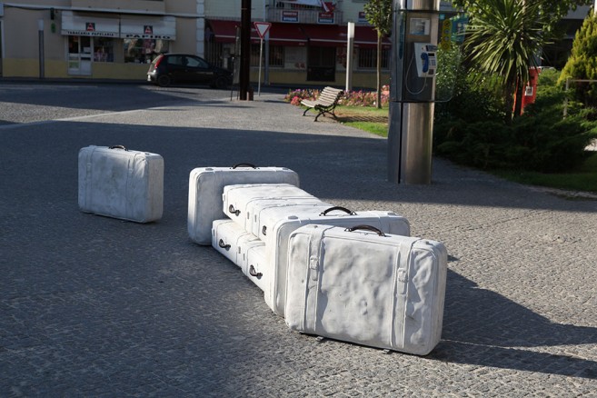 In tran-sit, 2002-2010 / Cast solid concrete and bronze / Life size suitcases
