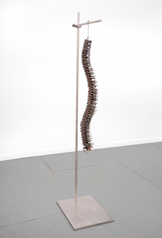 New Man, 2014 / Real handcuffs, cast bronze and stainless steel structure / 221.5 x  61 x 46 cm