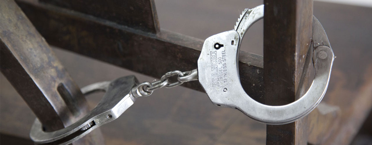 Doctrine, 2011 / Cast bronze and handcuffs / Variable dimensions