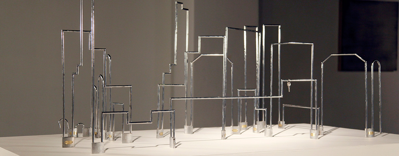 Totalitarismo, 2012 / Padlocks, silverplate metal structures and only one key in gold / Variable dimensions